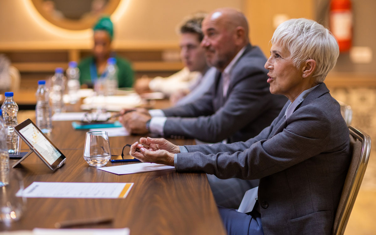 USC Distinguished Leaders Program Expert Advisors. Businesswoman participating in business conference at lecture hall