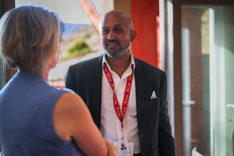 Mukund Kaushik chatting with an advisor