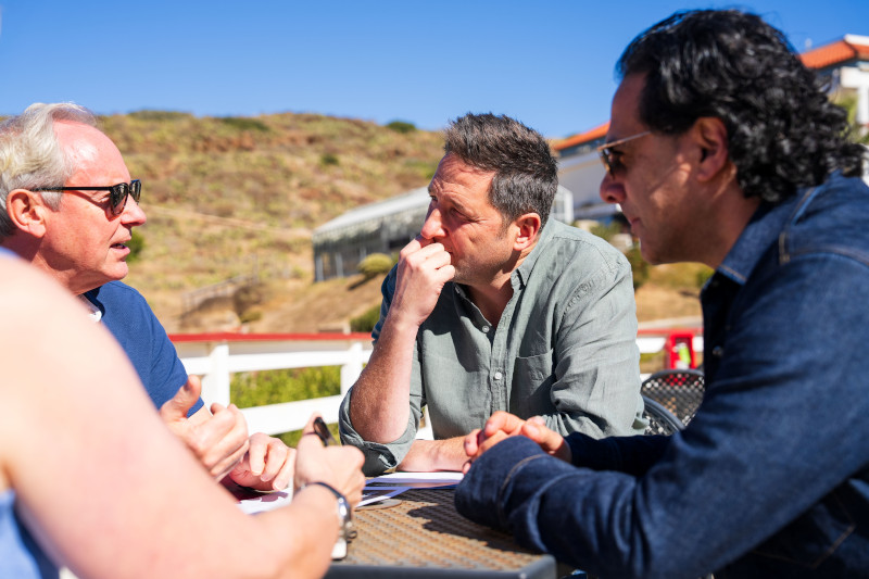 Distinguished Leaders expert advisors chatting outside