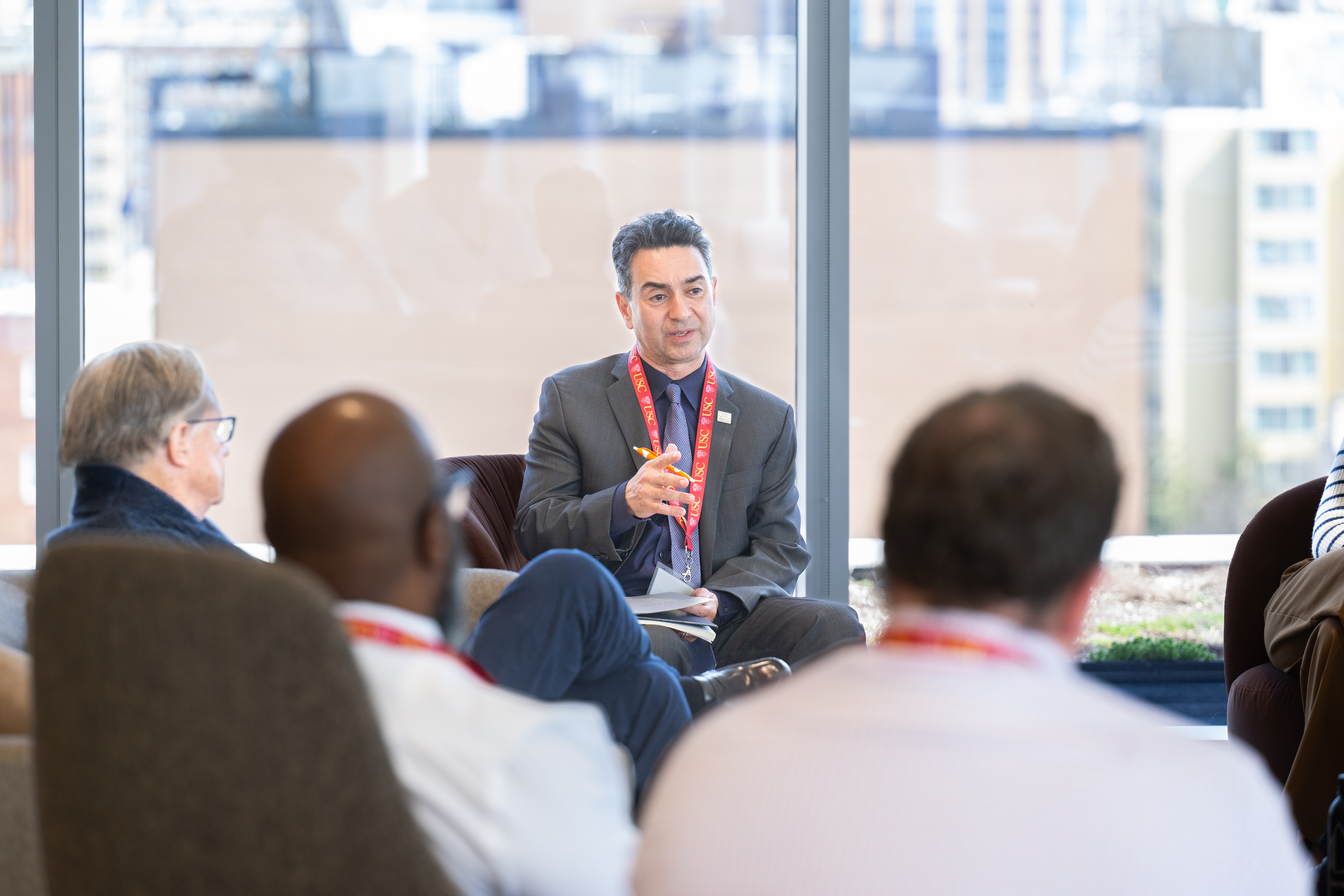 Advisor Kamy Akhavan speaking in front of USC Distinguished Leaders