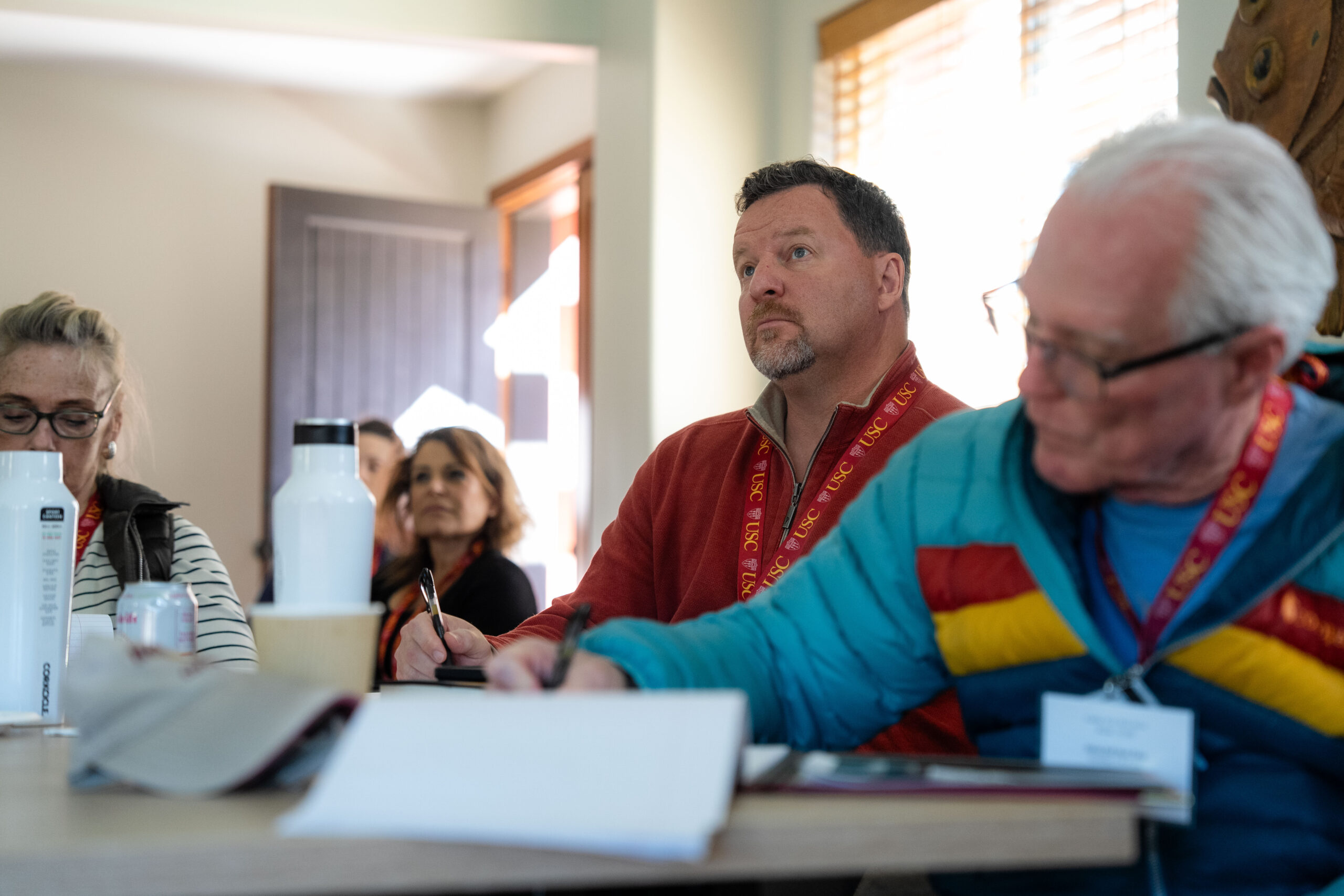 Distinguished Leaders listening attentively during a session